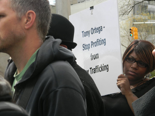 woman protesting tony ortega human trafficking