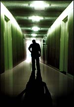 Psychiatrist walking alone down hallway