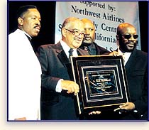 Isaac Hayes accepts award from the World Literacy Crusade on behalf of L. Ron Hubbard