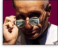 Man with money reflecting in glasses