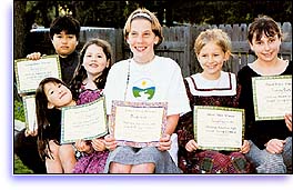 Girl with The Way to Happiness certificate